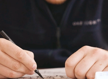 Person checking building regulations