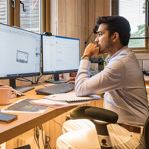 Architectural Designer at computer