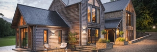 A contemporary oak home at night