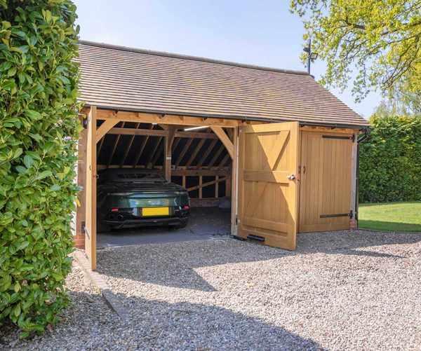 Oak frame 2 bay garage with classic car